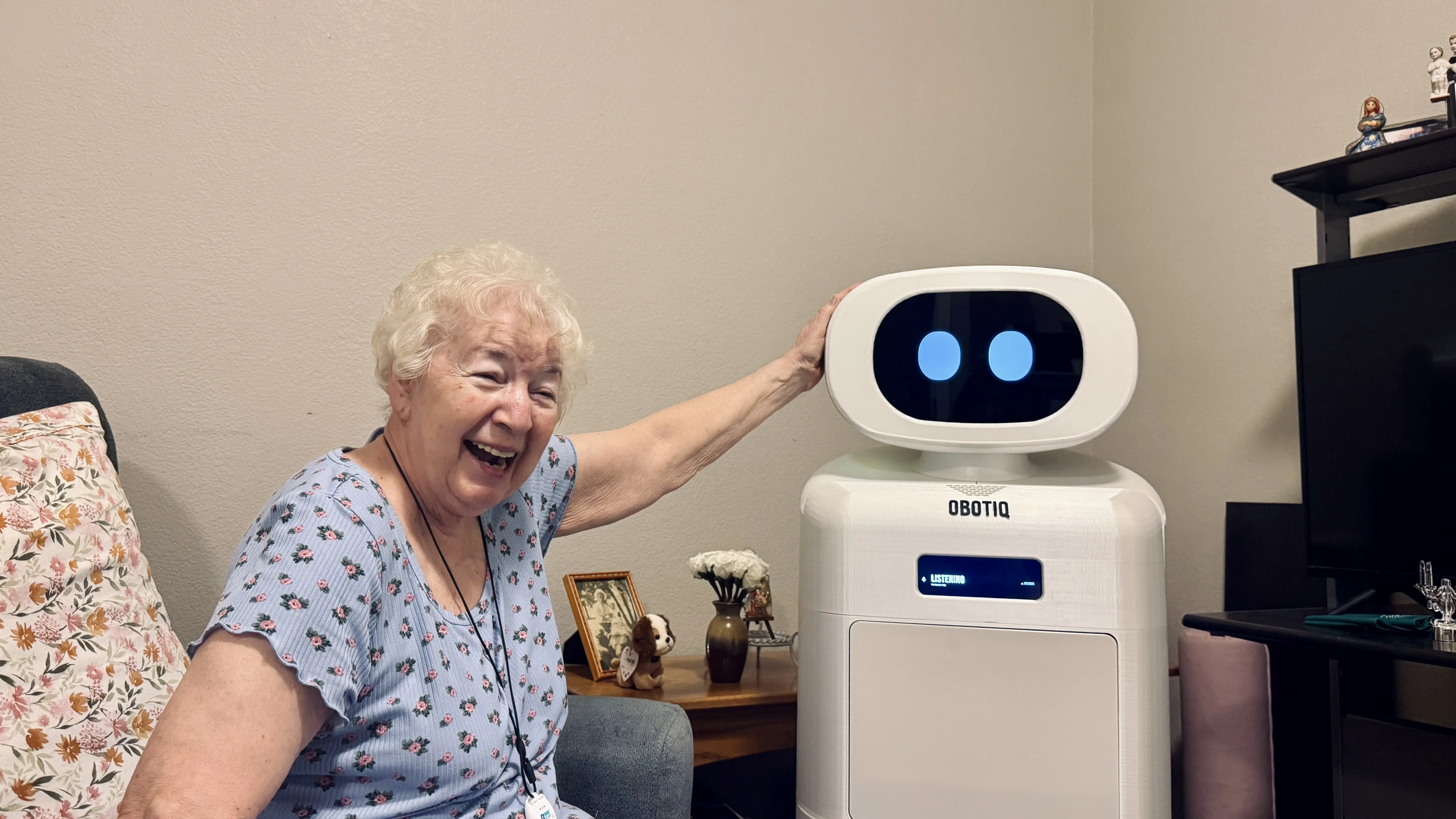 Resident smiling next to Gracie